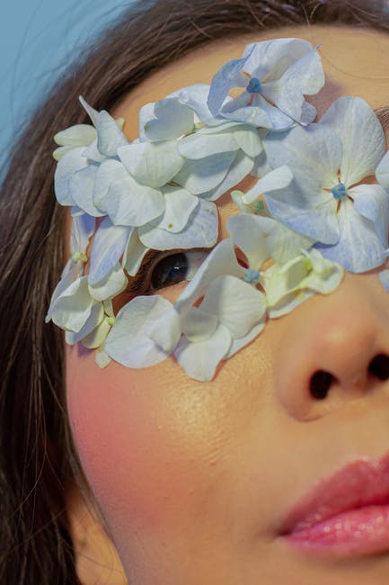 Close-up of a glowing face in soft shadow, emphasising skin texture
