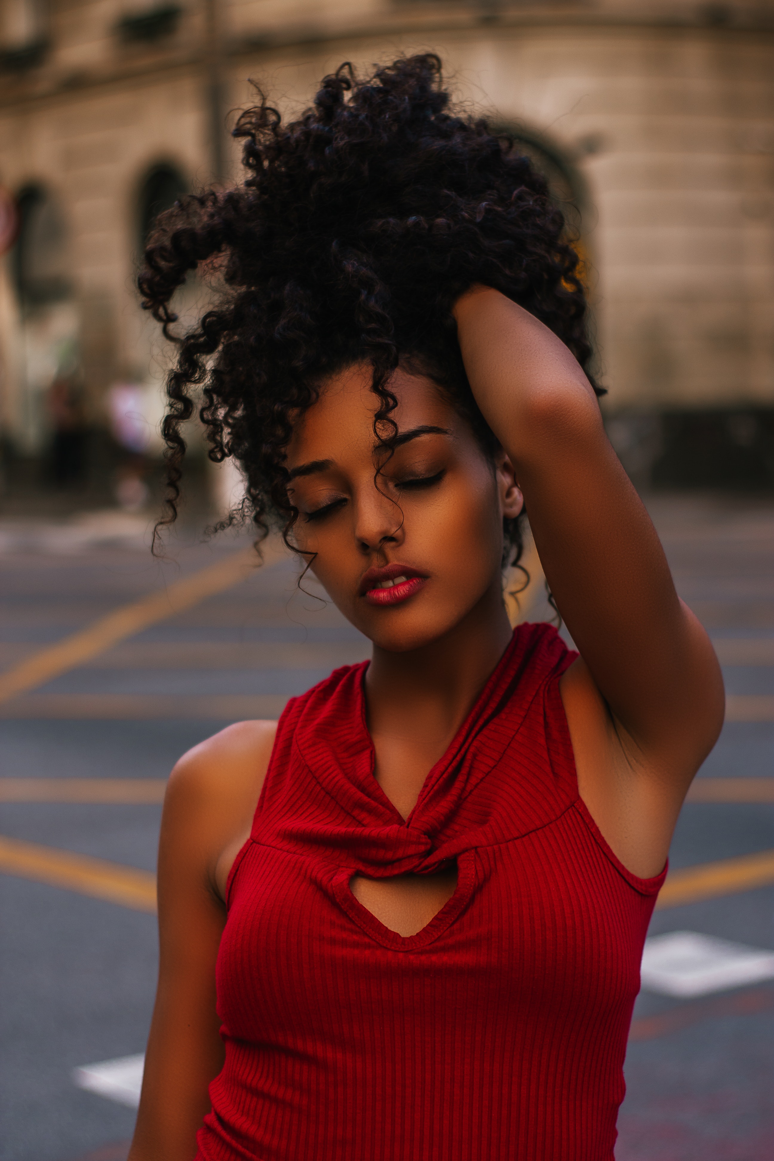 Woman with a defined curly updo hairstyle