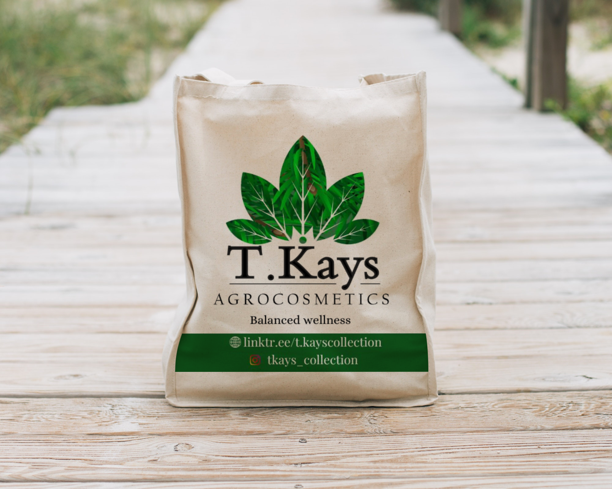 T.kays branded tote bag carried along a sunlit boardwalk